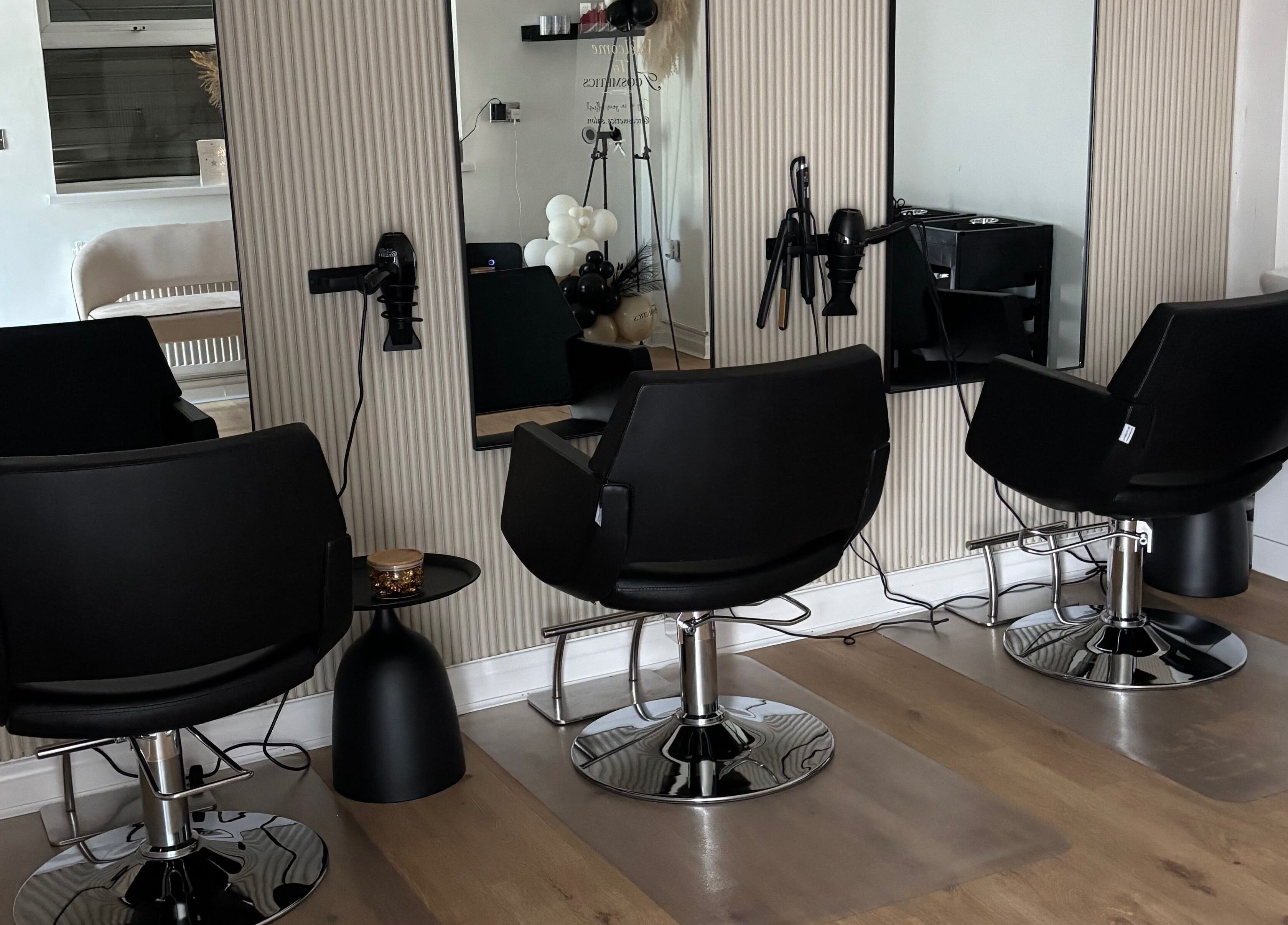 Modern salon chairs and mirrors at Tcosmetics in Swinton, England, GB offering premium beauty services.