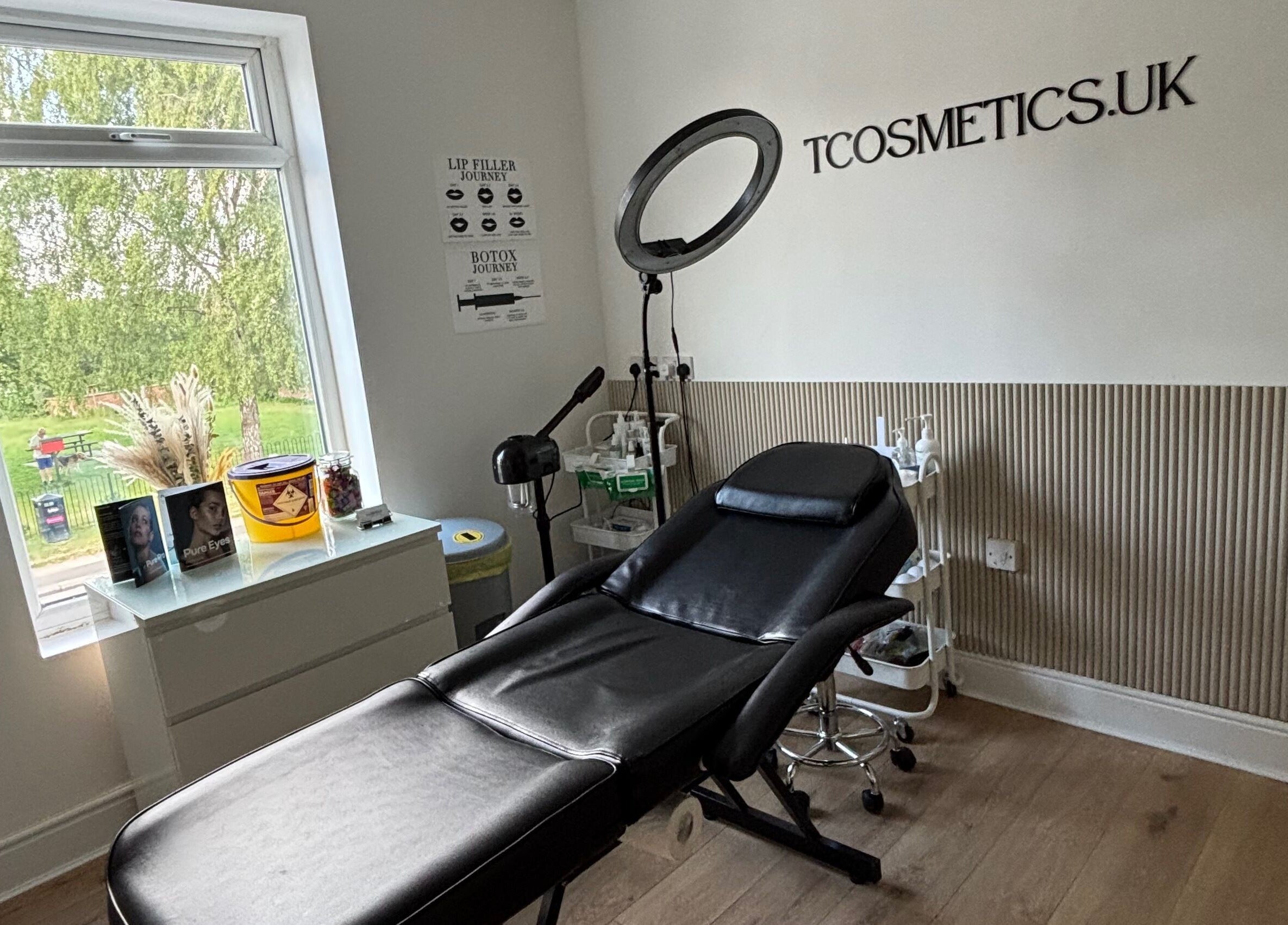 Tcosmetics treatment room with a recliner chair and ring light in Swinton, England, GB.