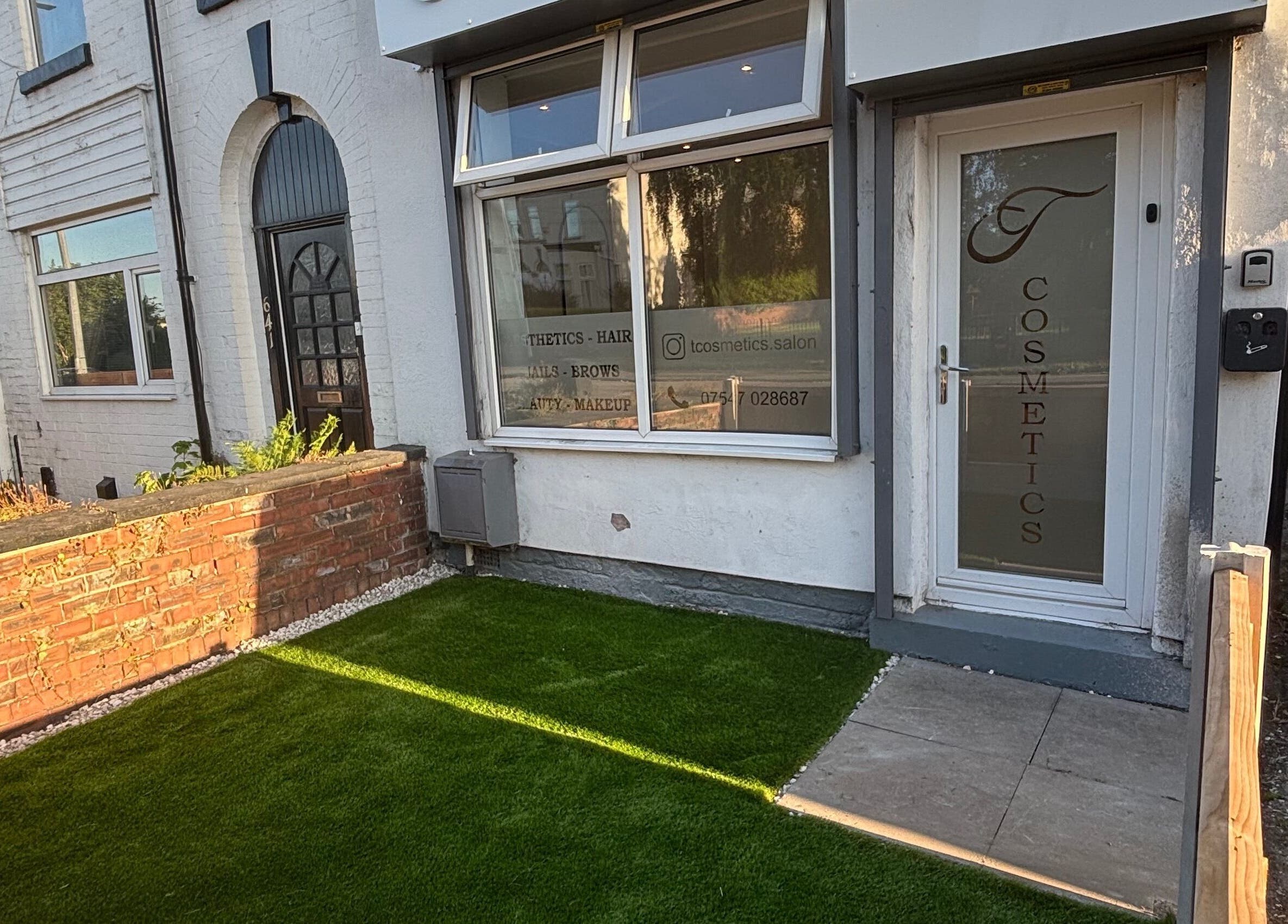 Front view of Tcosmetics in Swinton, England, GB showcasing stylish entrance and branded glass door.