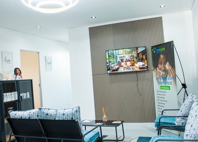Modern waiting area at Micure Aesthetics Clinic, Gaborone, with stylish seating and decor.