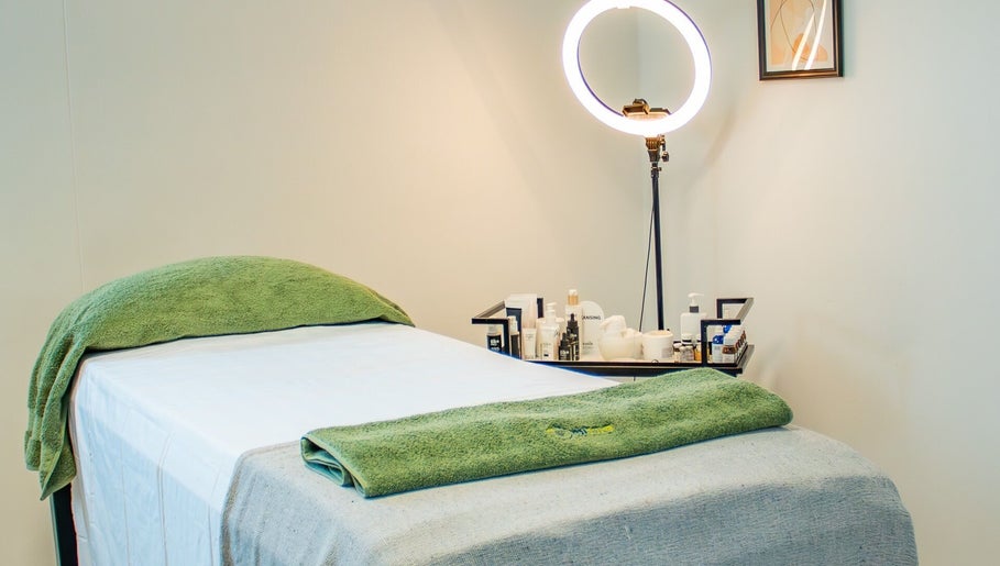 Treatment bed at Micure Aesthetics Clinic in Gaborone City, BW, ready for a calming experience.