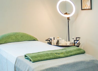 Treatment bed at Micure Aesthetics Clinic in Gaborone City, BW, ready for a calming experience.