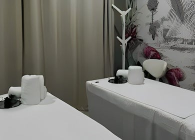 Relaxing massage room at Apple Blossoms Beauty and Spa, Roodepoort, Gauteng, ZA with elegant decor and cozy beds.