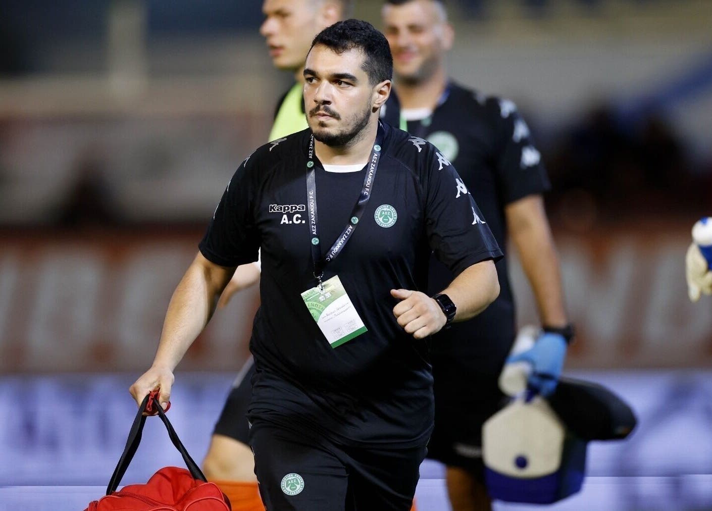 A professional holds a sports bag at AC Physiotherapy, Lemesos, Lemesos, CY, showcasing active wellness support.