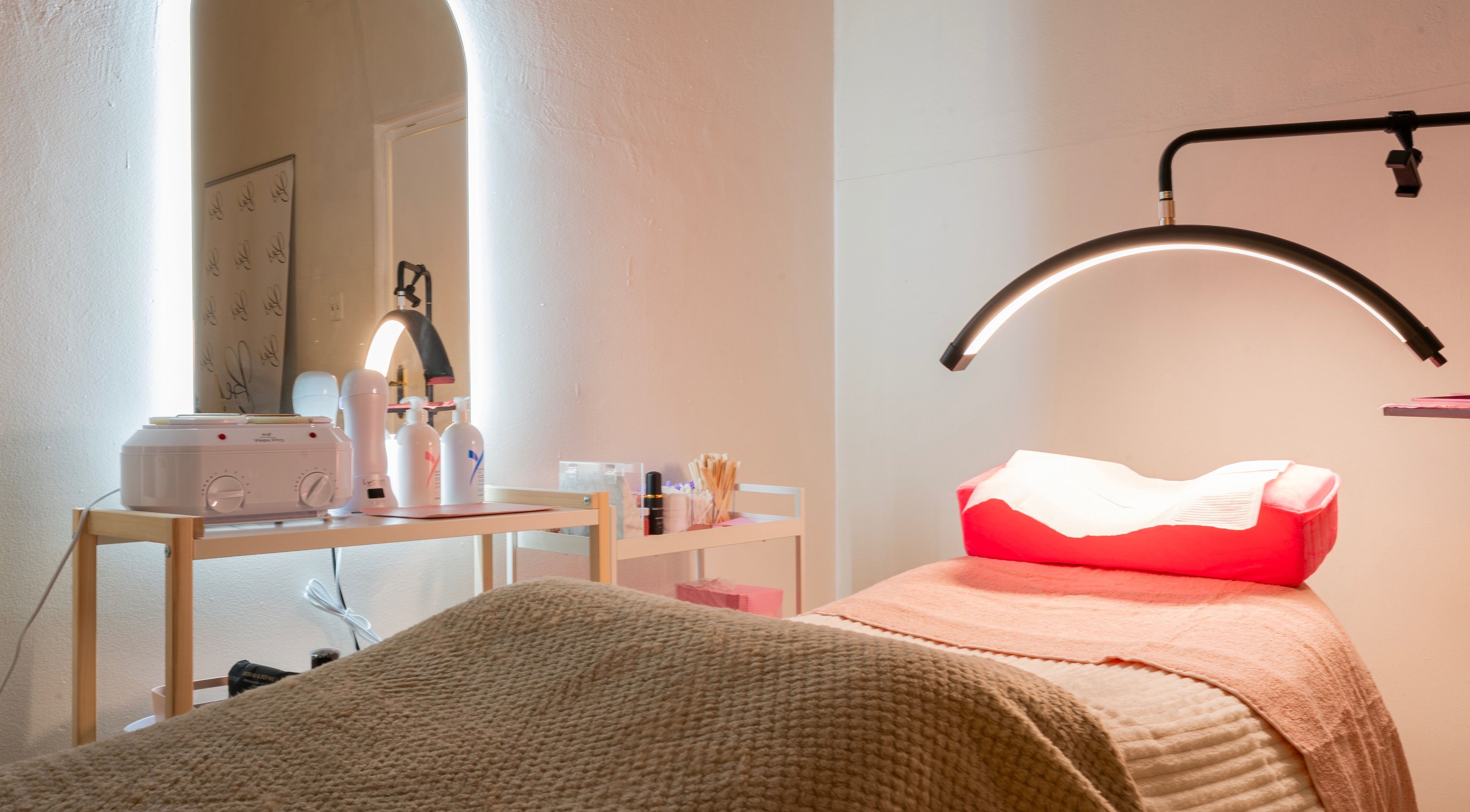Relaxing spa room at Pretty Kitty, Mount Hawthorn, Western Australia, AU featuring a treatment bed and equipment.