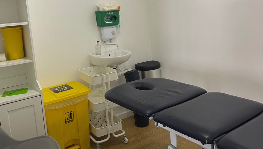 Clean therapy room at AF Sports Therapy in Birmingham, England, GB, featuring a treatment table and clinical supplies.