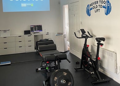 Exercise room at AF Sports Therapy, Birmingham, England, GB with gym equipment and motivational decor.
