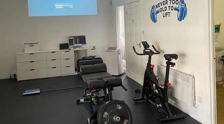 Exercise room at AF Sports Therapy, Birmingham, England, GB with gym equipment and motivational decor.