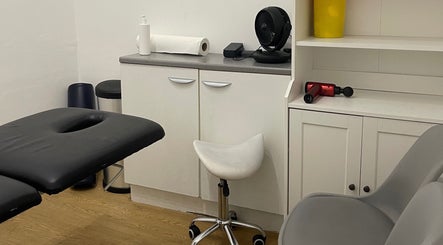 AF Sports Therapy treatment room in Birmingham, England, GB with a massage table and equipment.