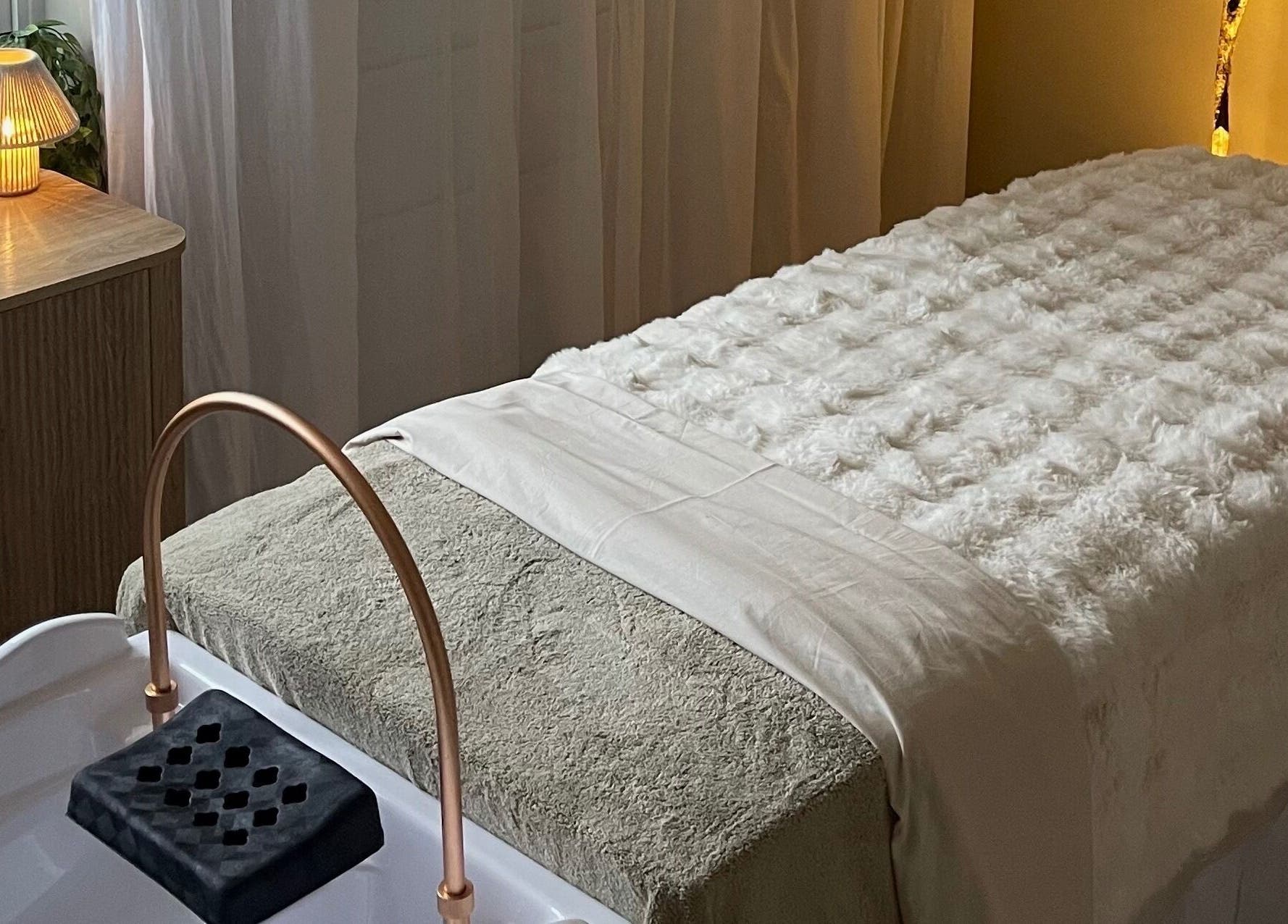 Relaxing spa bed setup at The HEAD SPAce Cambridgeshire in Huntingdon, England, GB featuring soft lighting.