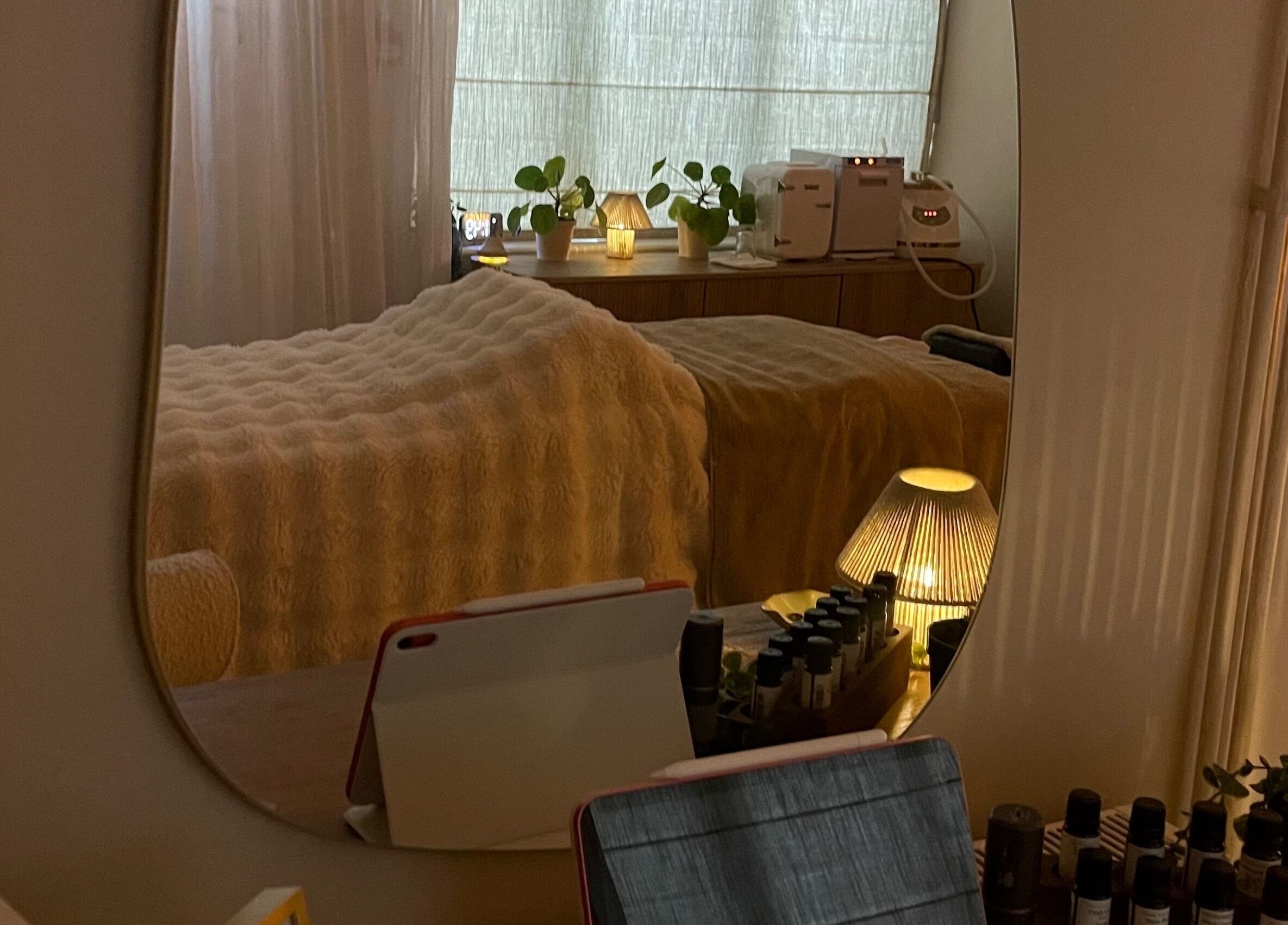 Tranquil therapy room at The HEAD SPAce Cambridgeshire in Huntingdon, England, GB with soft lighting and cozy decor.