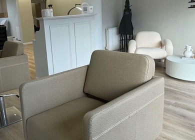 Relaxing seating area at BeautyByCoChlo | Chloe Turton, Normanton, England, GB with neutral tones.