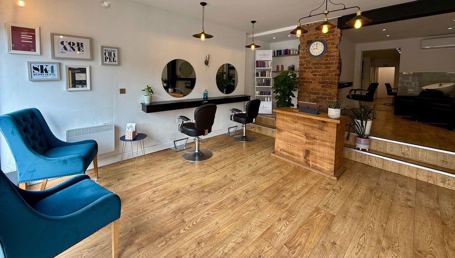 Modern salon interior at Kyleramsdenhair Co/Cobane, Stockport, England, GB featuring chic chairs and decor.