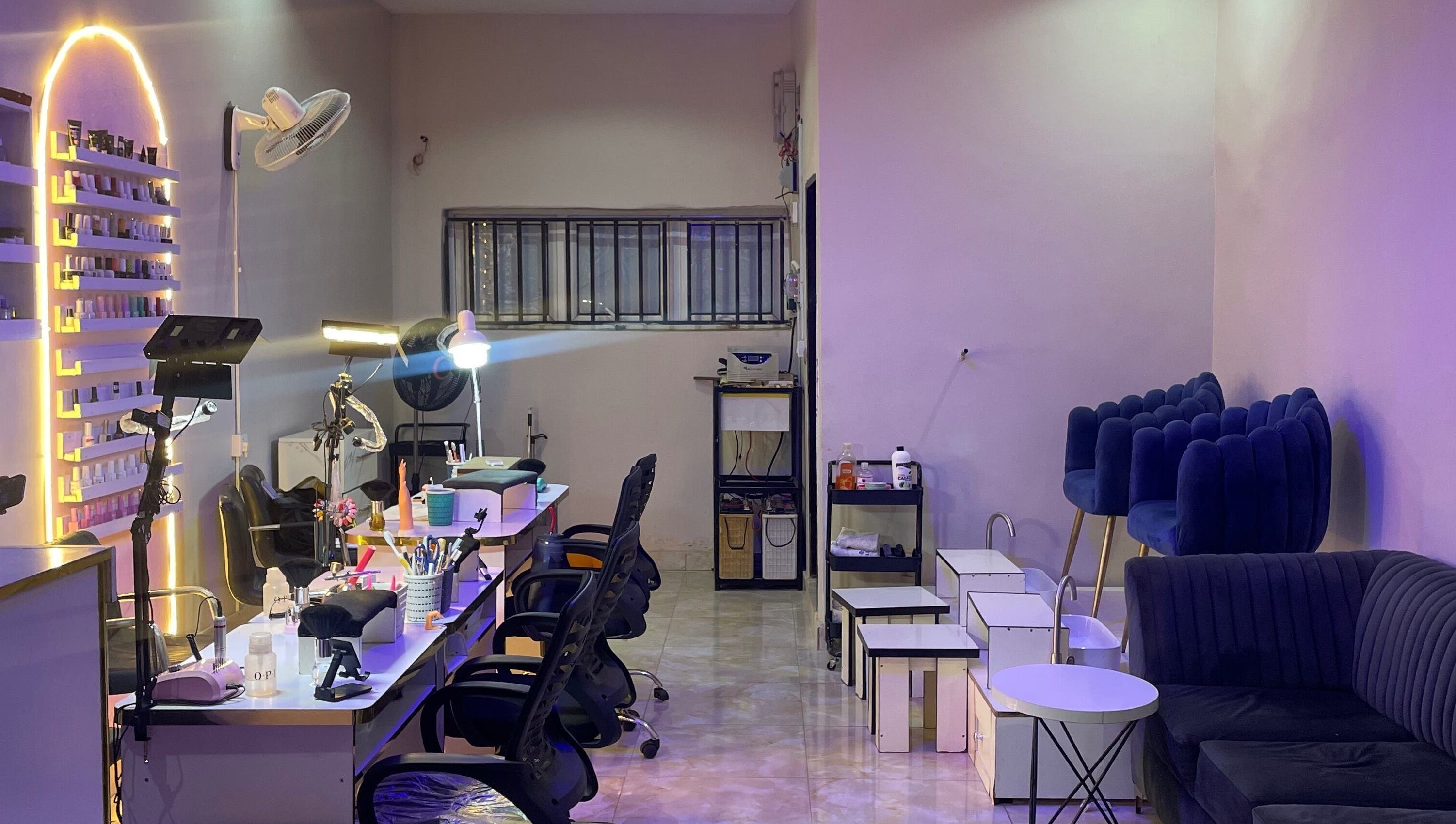 Elegant interior of Leo Nailx Salon in Abuja, Federal Capital Territory, NG with chic seating and modern decor.