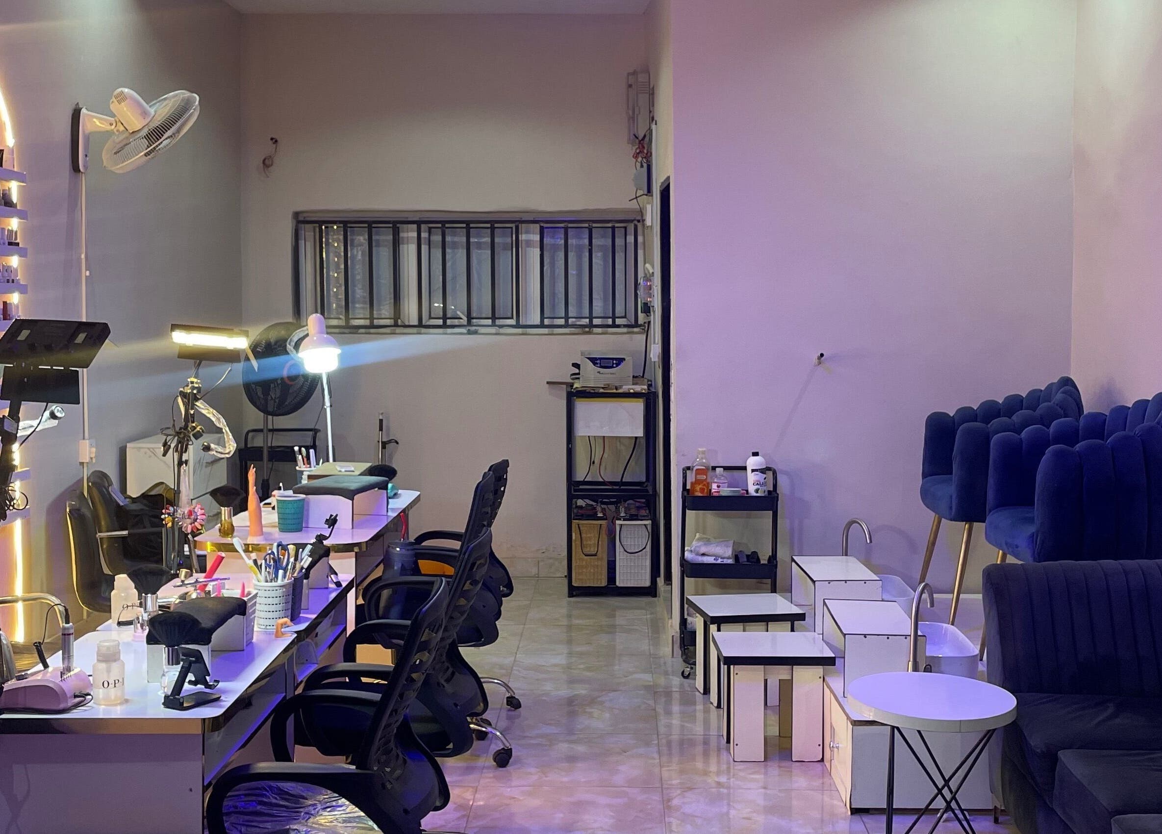 Elegant interior of Leo Nailx Salon in Abuja, Federal Capital Territory, NG with chic seating and modern decor.