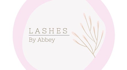 Delicate logo of Lashes by Abbey, Simcoe, Ontario, CA, featuring soft pink and branch design.