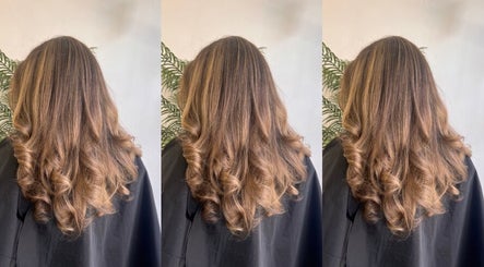 Voluminous curls styled at Hair by Zara Hinde in Glasgow, Scotland, GB, showcasing expert hair design.