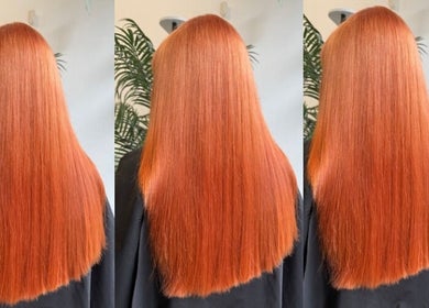 Vibrant red hair styled at Hair by Zara Hinde, Glasgow, Scotland, GB, showcasing sleek, shiny finish.