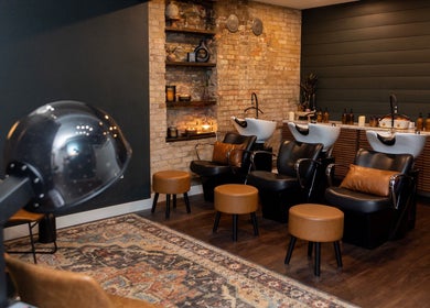Elegant salon wash stations at Sami's Signature Styles, Marshfield, Wisconsin, US with cozy seating and decor.