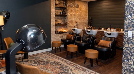Elegant salon wash stations at Sami's Signature Styles, Marshfield, Wisconsin, US with cozy seating and decor.