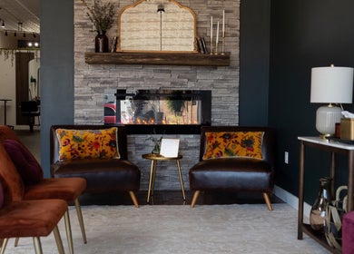 Inviting lounge at Samis Signature Styles in Marshfield, Wisconsin, US with elegant decor and warm fireplace.