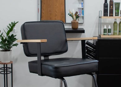 Modern salon chair in Samis Signature Styles at Canvas Loft, Marshfield, Wisconsin, US, with chic decor.