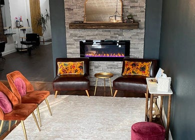 Elegant lounge at Samis Signature Styles at Canvas Loft, Marshfield, Wisconsin, US, featuring plush seating.