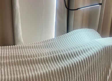 Comfortable treatment bed at Certified Beauty, Patchway, England, GB, featuring elegant lighting and cozy ambiance.