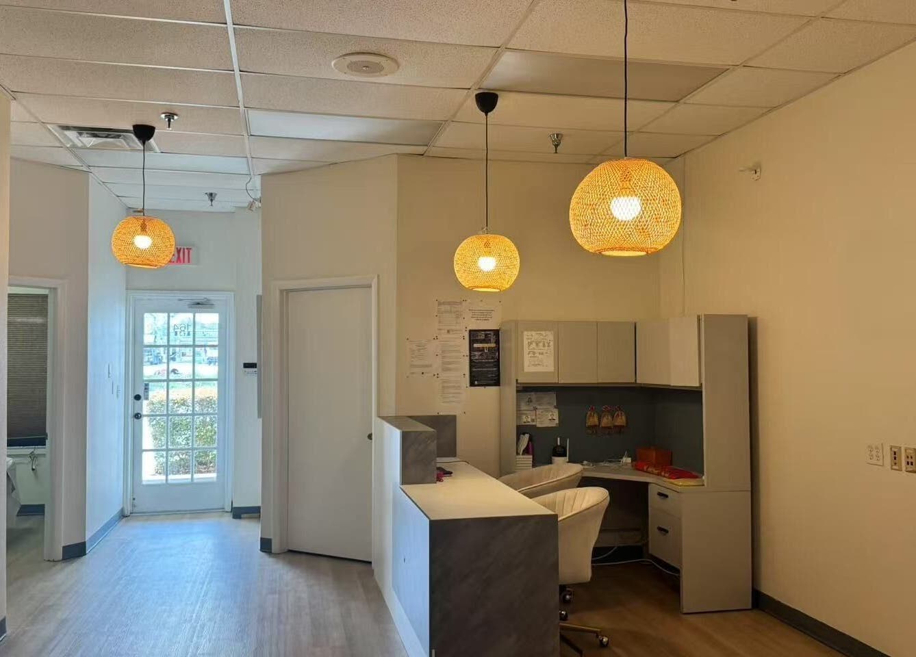 Elegant reception area at Elite Spa, Winter Springs, Florida, US, with modern decor and soothing lighting.