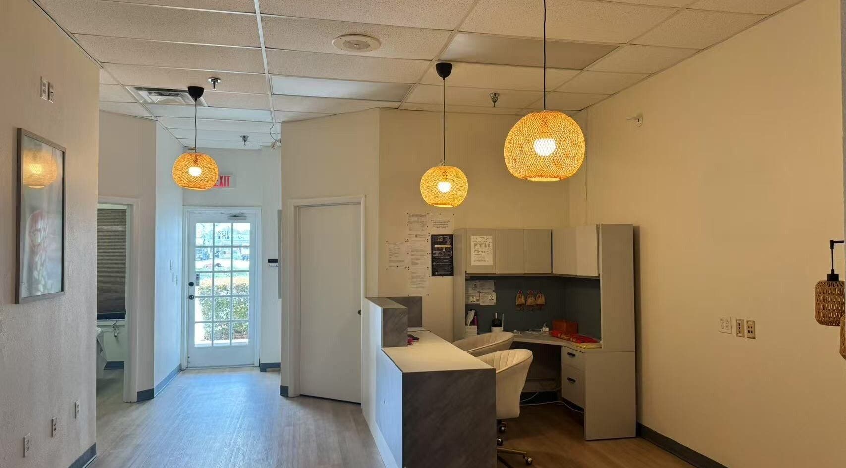 Elegant reception area at Elite Spa, Winter Springs, Florida, US, with modern decor and soothing lighting.
