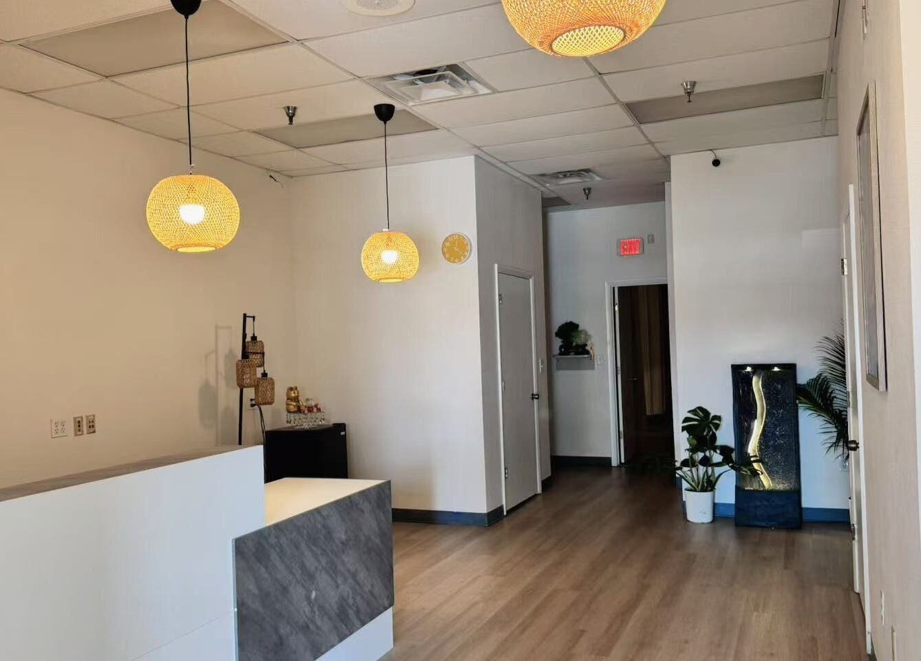 Warm, inviting lobby of Elite Spa in Winter Springs, Florida, US, with elegant lighting and modern decor.