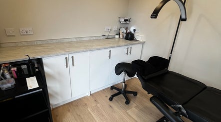 Modern treatment room at Studio Twenty Seven in Clevedon, England, GB with sleek design and relaxing chair.
