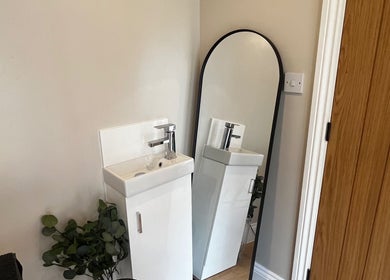 Elegant sink and mirror setup at Studio Twenty Seven, Clevedon, England, GB enhancing minimalist design.