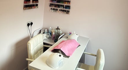 Nail station at Bellissima, Borehamwood, England, GB featuring nail polish display and comfy chairs.