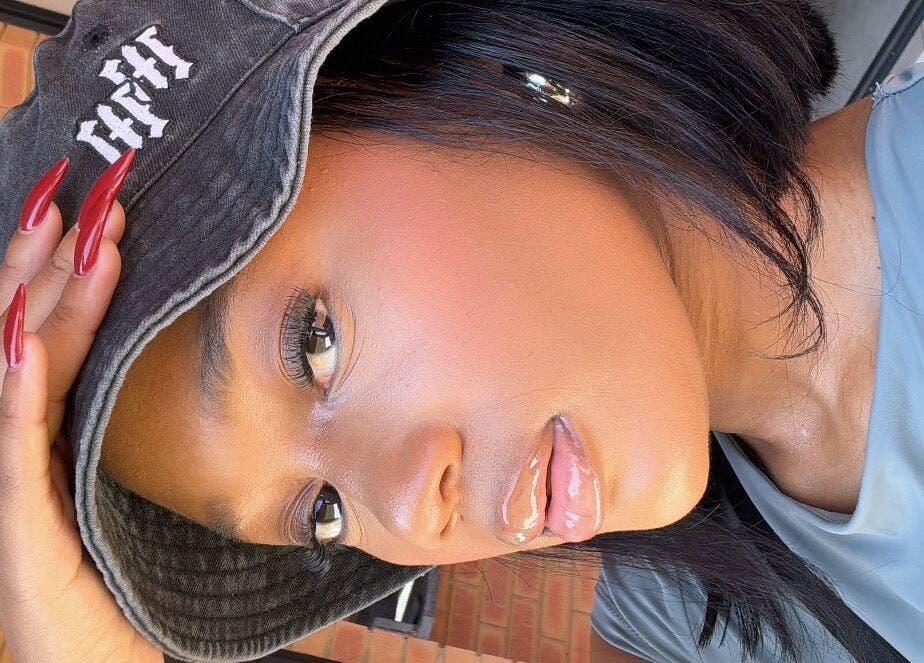 Close-up of a glamorous person at RSK Beauty, featuring sleek style in Mbombela, Mpumalanga, ZA.