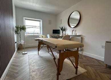 Peaceful therapy room at Nutritionally, Liverpool, England, GB with massage table and modern decor.