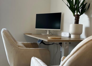 Elegant minimalist workspace at Nutritionally, Liverpool, England, GB with modern desk and plush chairs.