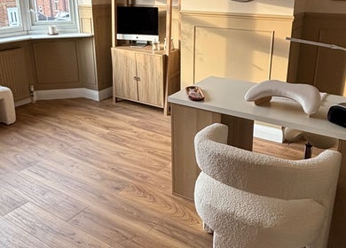 Bright, cozy interior of Olivia Jean Nail Studio, Derby, England, GB, showcasing elegant nail station setup.
