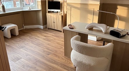Bright, cozy interior of Olivia Jean Nail Studio, Derby, England, GB, showcasing elegant nail station setup.