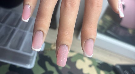 Elegant pink and white French manicure with glitter at NJK beauty, Shirebrook, England, GB.