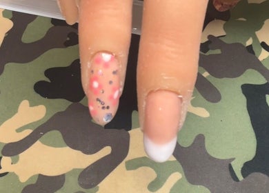 Unique nail art design at NJK beauty, Shirebrook, England, GB showcasing vibrant colors and patterns.