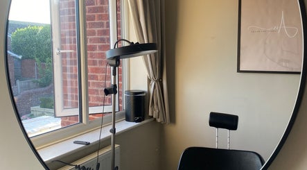Modern, stylish salon interior with chair and mirror at Air Lashes and Brows, Ludlow, England, GB.