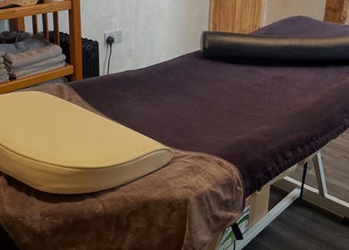 Massage table at Marie’s Sports and Wellbeing Massage, Porthleven, England, GB, ready for relaxation.