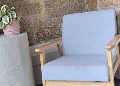 Inviting seating area at Crystal Hair Adelaide, featuring a modern chair and plant in Parkside, South Australia, AU.