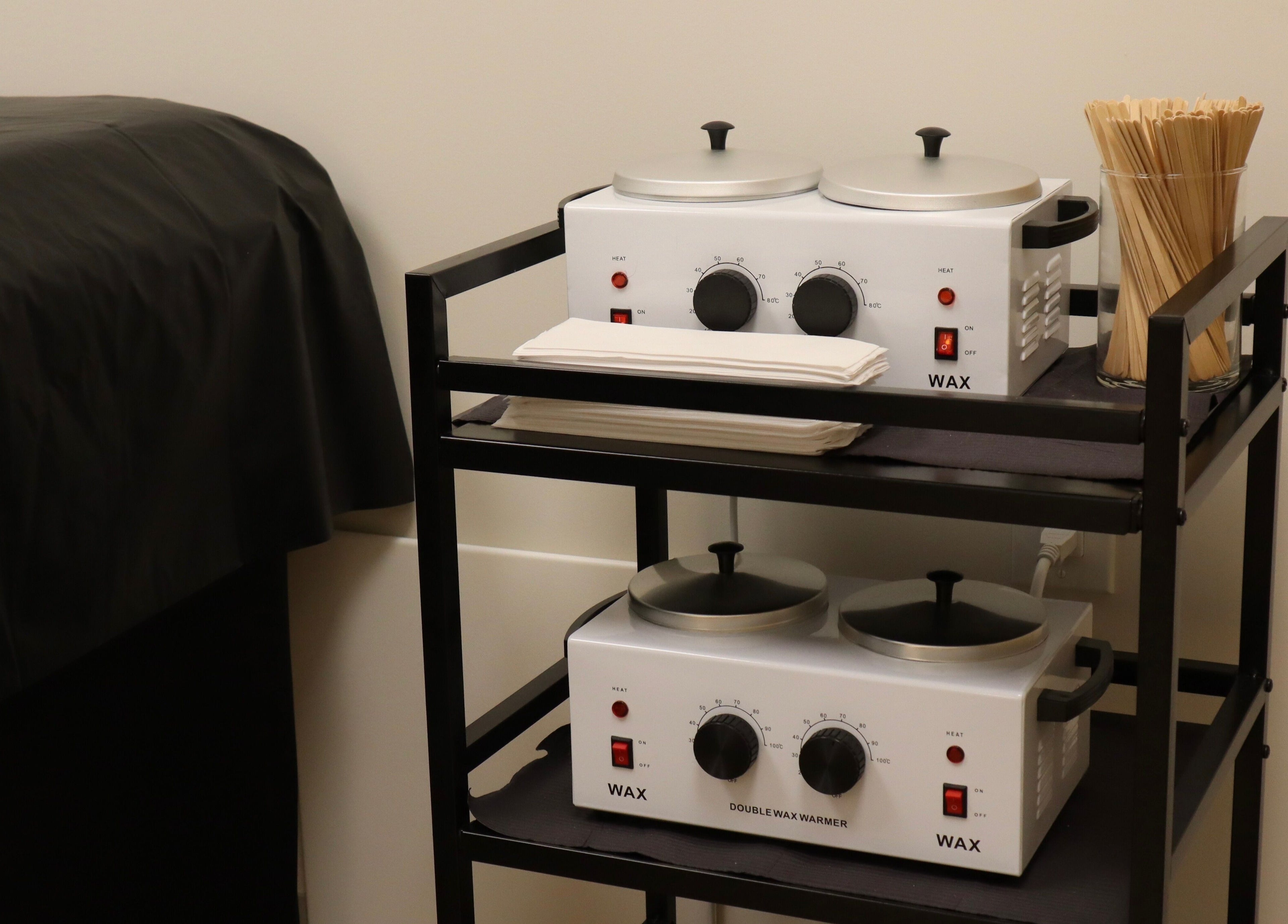 Waxing equipment at DIVINE DERMABAR, Toronto, Ontario, CA offering premium beauty treatments.