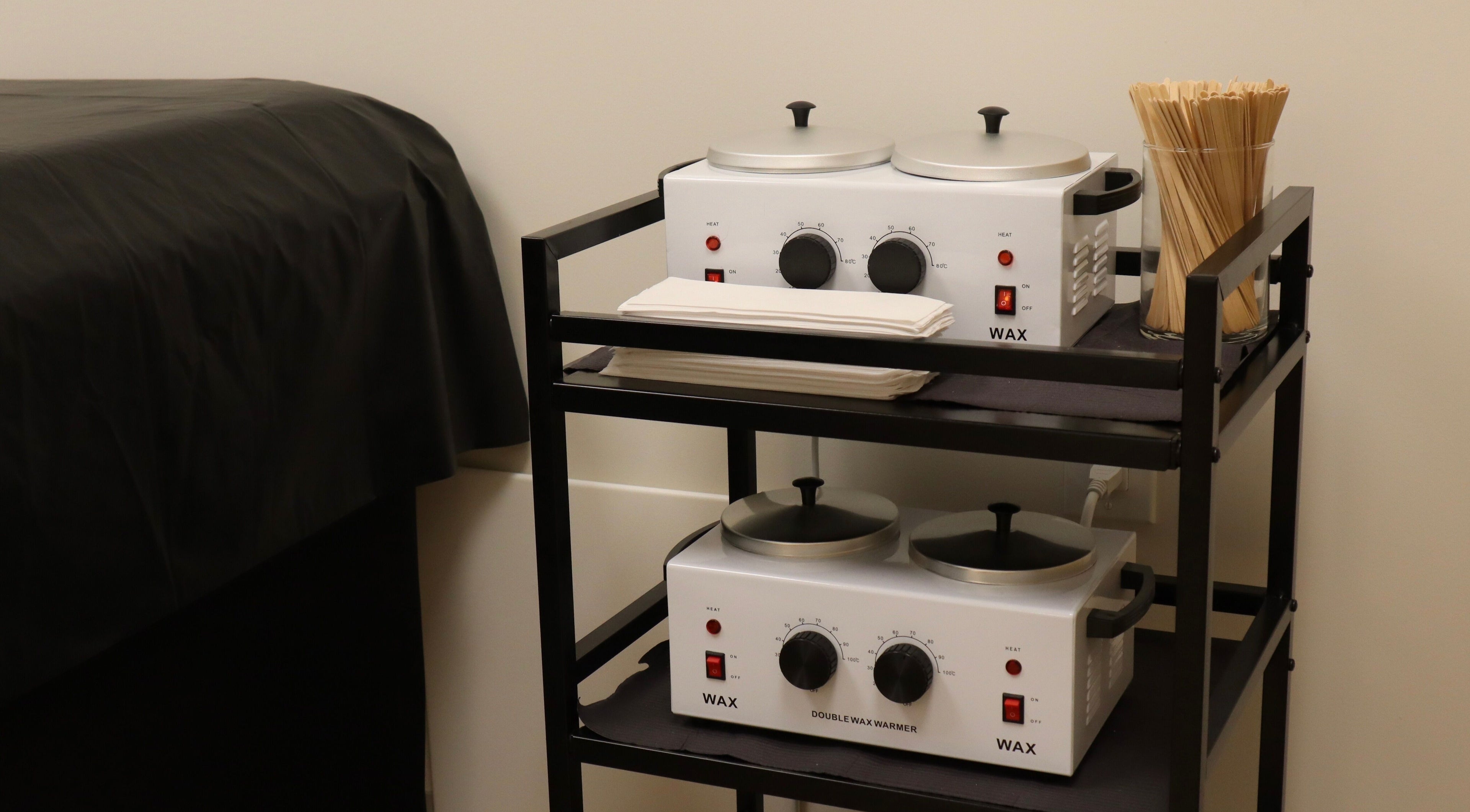 Waxing equipment at DIVINE DERMABAR, Toronto, Ontario, CA offering premium beauty treatments.