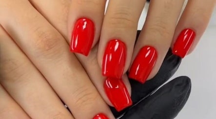 Elegant red manicure at Nail’s by yilm, Lakeland, Florida, US, showcasing expert nail artistry.