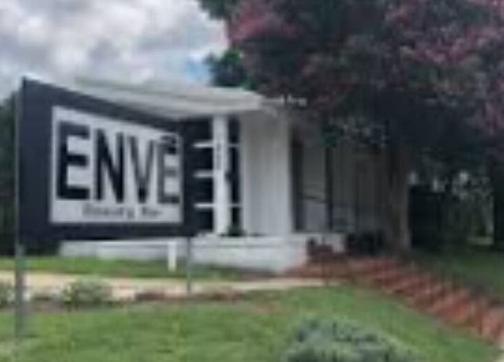 Front view of Anatomia in Waco, Texas, US, showcasing a welcoming exterior surrounded by lush greenery.