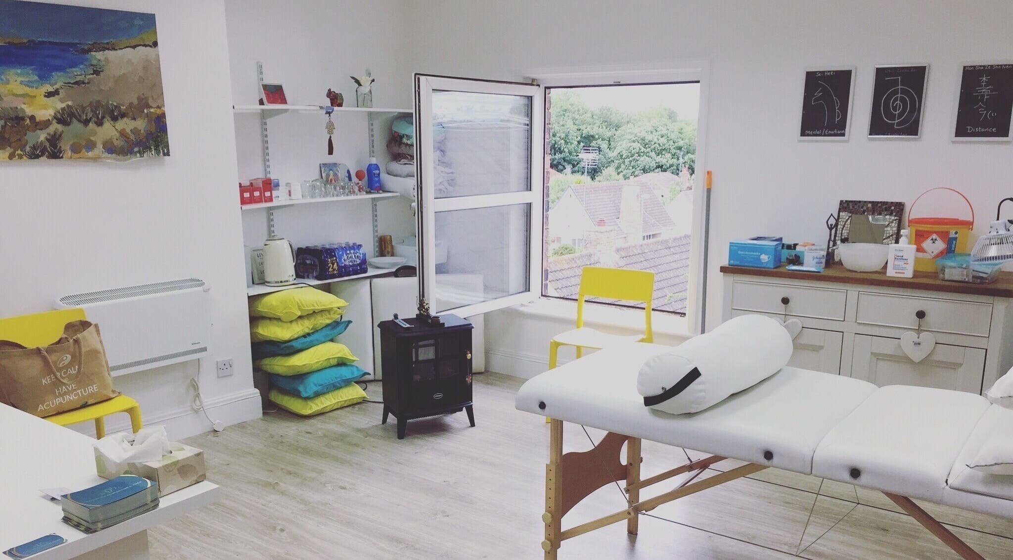 Tranquil therapy room at Boston Spa Acupuncture and Yoga, Leeds, England, GB with bright decor and treatment table.