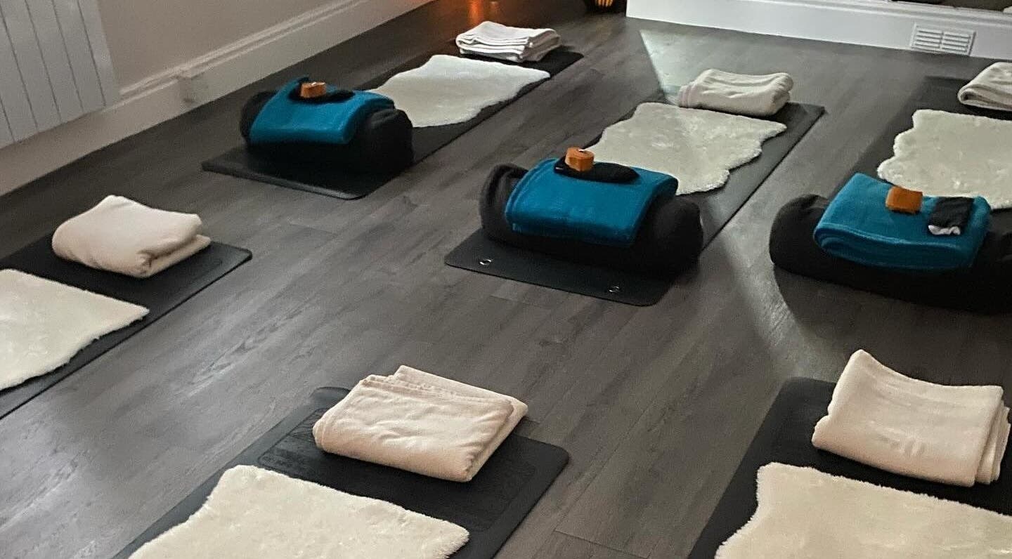 Cozy yoga setup at Boston Spa Acupuncture and Yoga, Leeds, England, GB, with mats, blankets, and bolsters.
